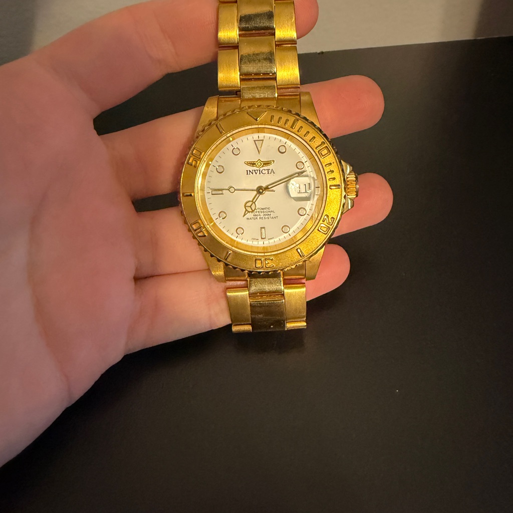 Invicta Gold Timepiece With White Face